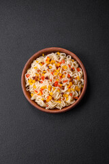 Delicious fresh Asian noodles with pieces of vegetables, meat, with salt, spices and herbs