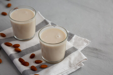 Organic White Almond Milk in Glasses, side view. Copy space.