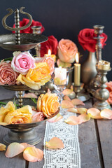 Romantic table decoration with roses and candles. Valentine's Day decorating ideas.