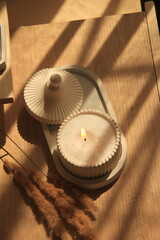 sand candle in plaster jar