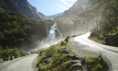 The beautiful trail to Briksdalsbreen Glacier in Olden, Nordfjord, Norway. The stormy river...