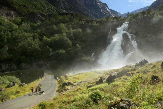 The beautiful trail to Briksdalsbreen Glacier in Olden, Nordfjord, Norway. The stormy river Briksdalselva formed as a result of the melting of a glacier.
