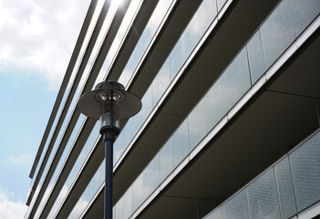 Low angle view of street lamp in front of building