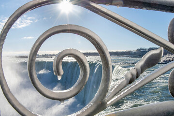 Close up of the ornamental fence covered with thick layer of ice on the Niagara Falls, ON, Canada...