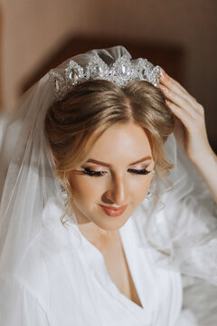 Luxury wedding crown diadem on bride's head hairstyle. morning wedding preparation bride with crown close up