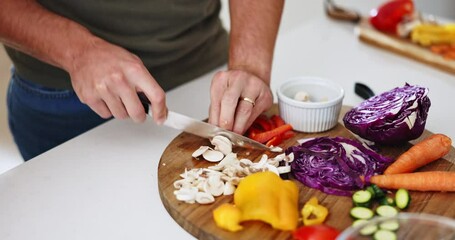 Hands, knife and cutting vegetables in kitchen, home and ready with cooking, preparation and nutrition. Man, diet and mushrooms with vegan meal, food or healthy product for dinner, brunch or wellness