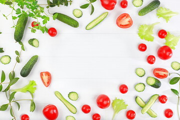 Naklejka premium Tomatoes, cucumbers and parsley for cooking salad, Fresh summer vegetables on a bright sunny table with place for text, detox diet and weight loss concept. Healthy and natural food, 