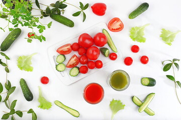Tomato juice, cucumber smoothie and ingredients on a bright table. Detox diet and weight loss concept, natural nutrition, healthy and wholesome food. Summer drinks, vitamin C, 