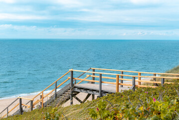 Sylt Island landscape with wooden stairs and the North Sea at