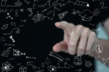 Male hand writing mathematical formulas on blurry background. Science and algebra concept. Double...