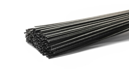 Black rice noodles, organic dried black and brown rice pasta isolated on white