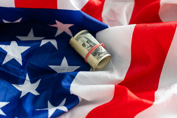 Dollar cash money on american flag.