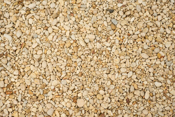 The texture of small multicolored pebbles as a background.