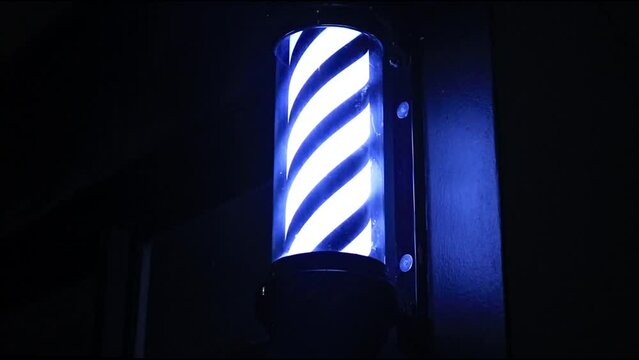 Black and White Barber Pole Rotating at Night