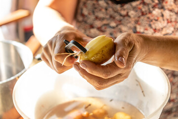 woman peeling a potato, 