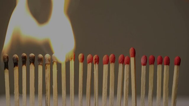 4K video of matches in a row showing concept of separation effect during covid