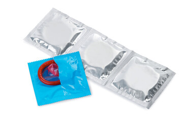 Packaged condoms on white background. Safe sex