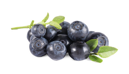 Delicious ripe bilberries and green leaves isolated on white