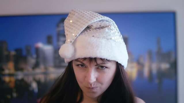 Playful Temptation: Snow Maiden Hat-Wearing Woman Seductively Gazes and Flirts at the Camera