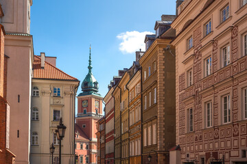 Street in old town with Royal Castle Clock Tower - Warsaw, Poland