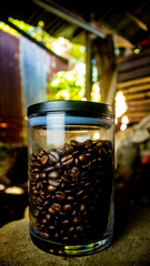 delicious coffee beans in a jar