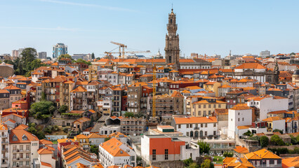 Fototapeta na wymiar Cityscape and roofs panorama of Porto, Portugal in august 2023