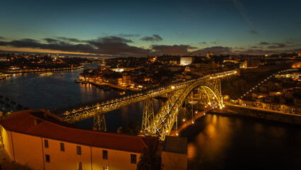 Famous Dom-Luis bridge illuminated in Porto at night on Portugal, in August 2023