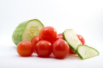 Macro Image of Sliced Cucumber and Mini Red Tomatoes Isolated on white Background