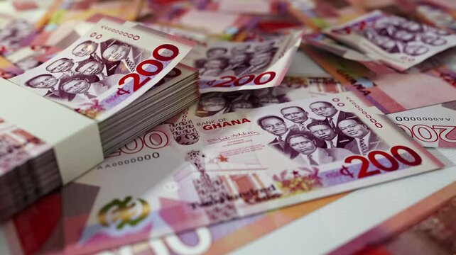 3D animation of Camera panning around spread 200 Ghanaian cedi notes. Camera moving around Scattered cedi notes on surface
