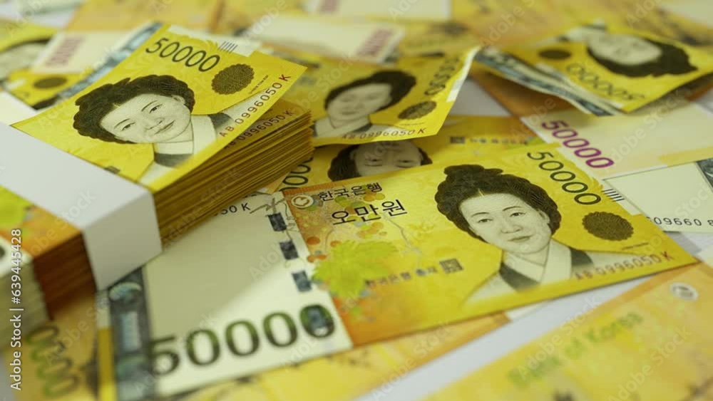 Poster 3d animation of camera panning around spread south korean won notes. camera moving around scattered 