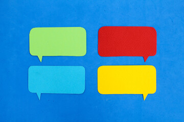 four conversation bubbles with a blue background or isolated background. sample for writing space. copy space for text. speech bubble