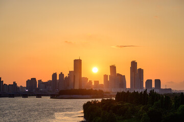 The night view of the city of Yeouido, a high-rise building, shot at Dongjak Bridge in Seoul at sunset