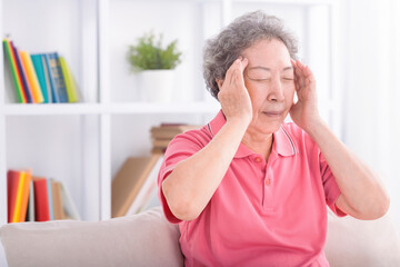 Senior woman suffering from a headache