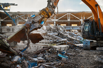 Excavator destroyer removes debris winter day - obrazy, fototapety, plakaty