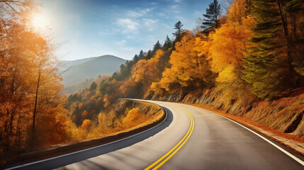 Scenic mountain road with autumn woods