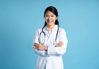 image of asian female doctor posing on blue background