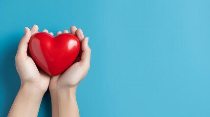 Obraz premium World Heart Day Concept with Hands Holding Red Heart