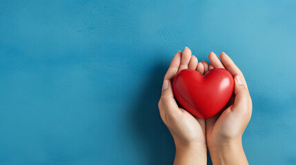 World Heart Day Concept with Hands Holding Red Heart