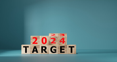 2024 target concept. flip wood cube change year 2023 to 2024