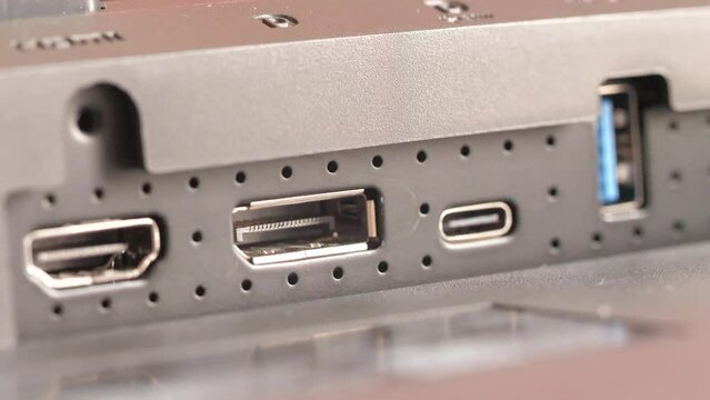 Hand of people removing DP port from device