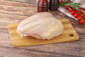 Raw chicken breast with bone