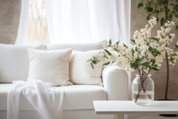 Close up of a sofa, coffee table and plants in a minimalistic living room staging