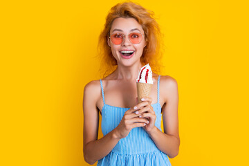 amazed woman with cone icecream isolated on yellow. woman with cone icecream in studio.