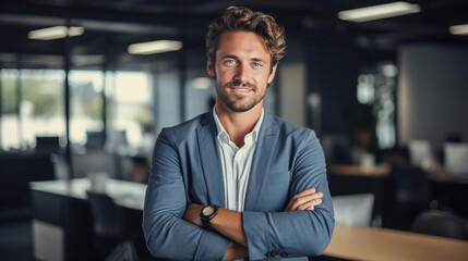 Fototapeta premium A Portrait of handsome smiling man sitting with arms crossed in office and looking at camera High quality photo with copy space.