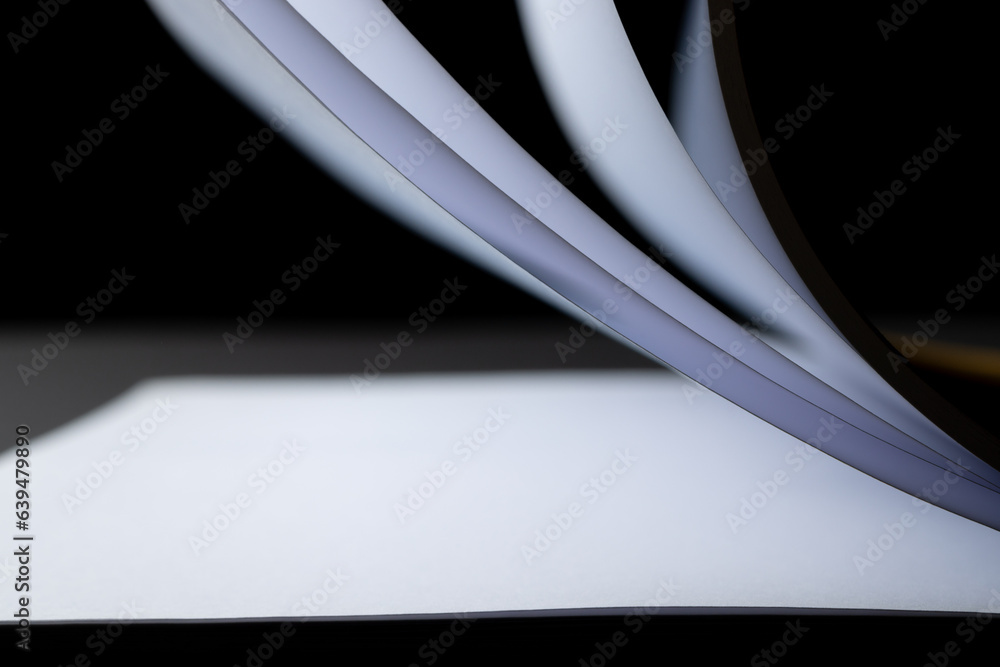 Poster micro of notebook pages and copy space on black background