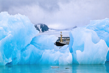 Ice floe with a ship behind the ice in arctic © Lars Johansson