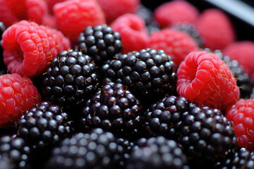 Assorted berries in bowl on natural background. Selectve focus. High quality photo