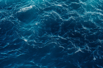 Fototapeta na wymiar High angle shot of the Deep blue ocean with waves and ripples