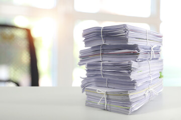 Pile or heap of financial business document paperwork stack on office desk concept of workload overtime or workplace paperless copy - obrazy, fototapety, plakaty
