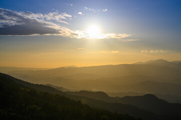 The sun moves in the direction of the mountains on the horizon. The Wufenshan Weather Radar Station stands on the top of the mountain. Taiwan